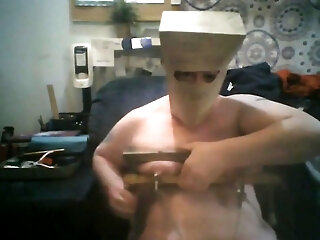 Fat Slut Pig With Bag On Her Head And Tits In Wooden Rack Masturbates On Egg Beater