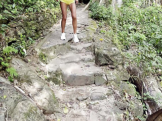 Monika Fox In Pink Top And Yellow Shorts Walks Through Jungle And Waterfalls